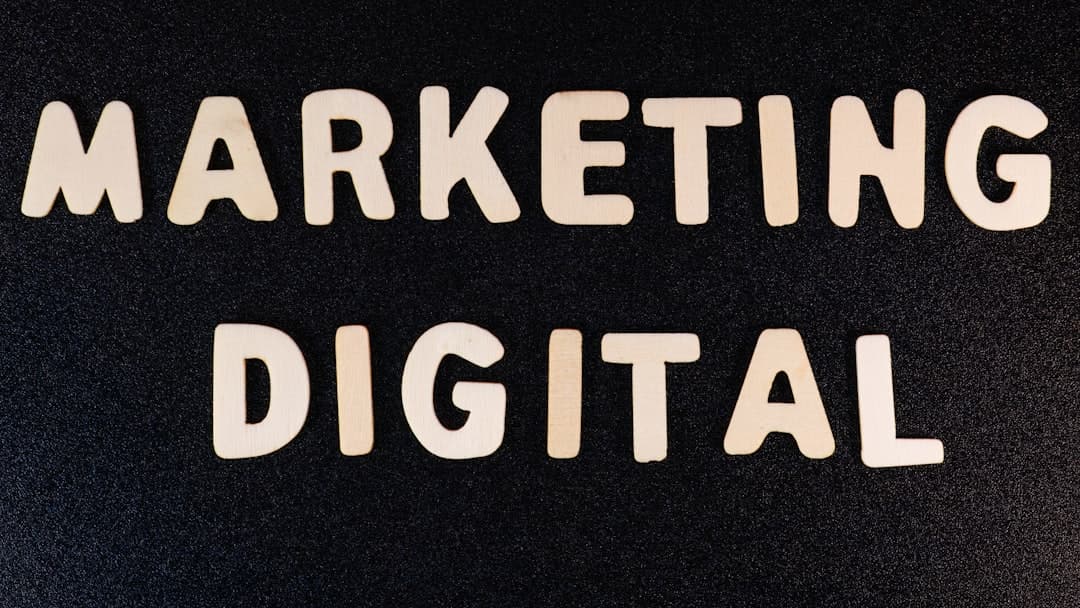 Professional digital marketing team working on campaigns with laptops, analytics charts, and marketing materials